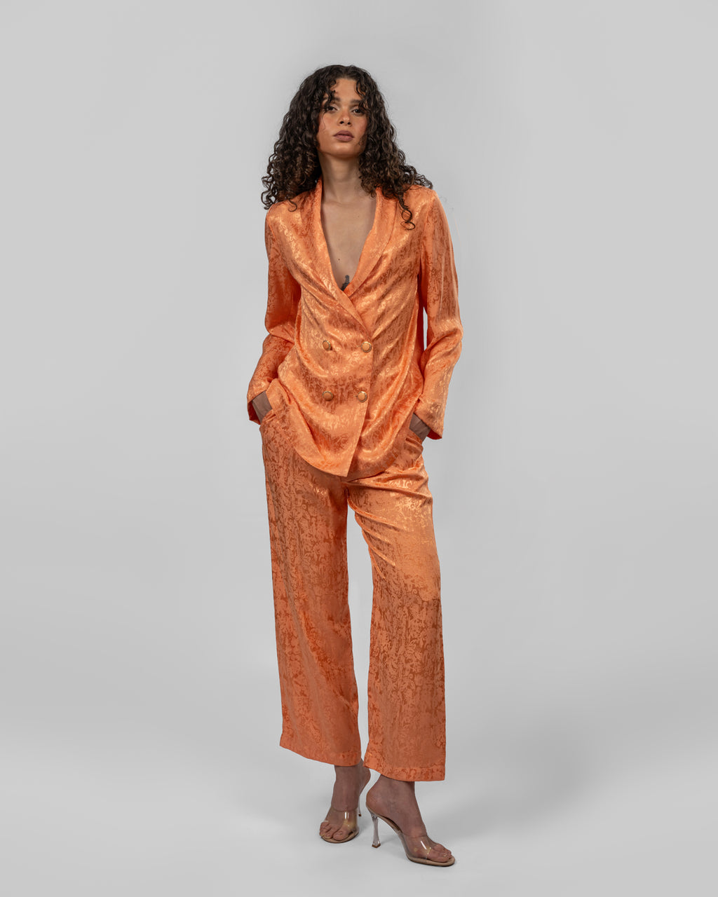 Set of loose-fit wrapped blazer and trousers.