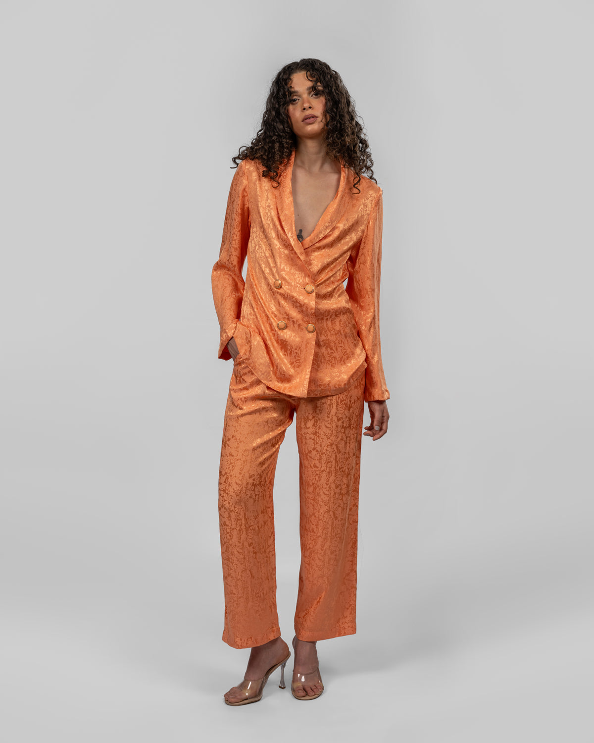 Set of loose-fit wrapped blazer and trousers.