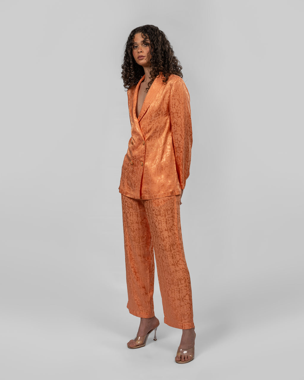 Set of loose-fit wrapped blazer and trousers.