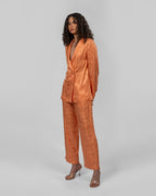 Set of loose-fit wrapped blazer and trousers.