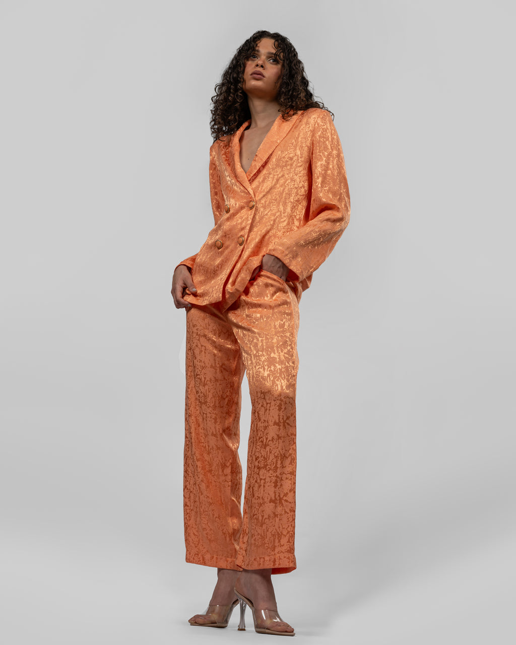 Set of loose-fit wrapped blazer and trousers.