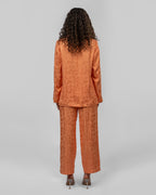 Set of loose-fit wrapped blazer and trousers.