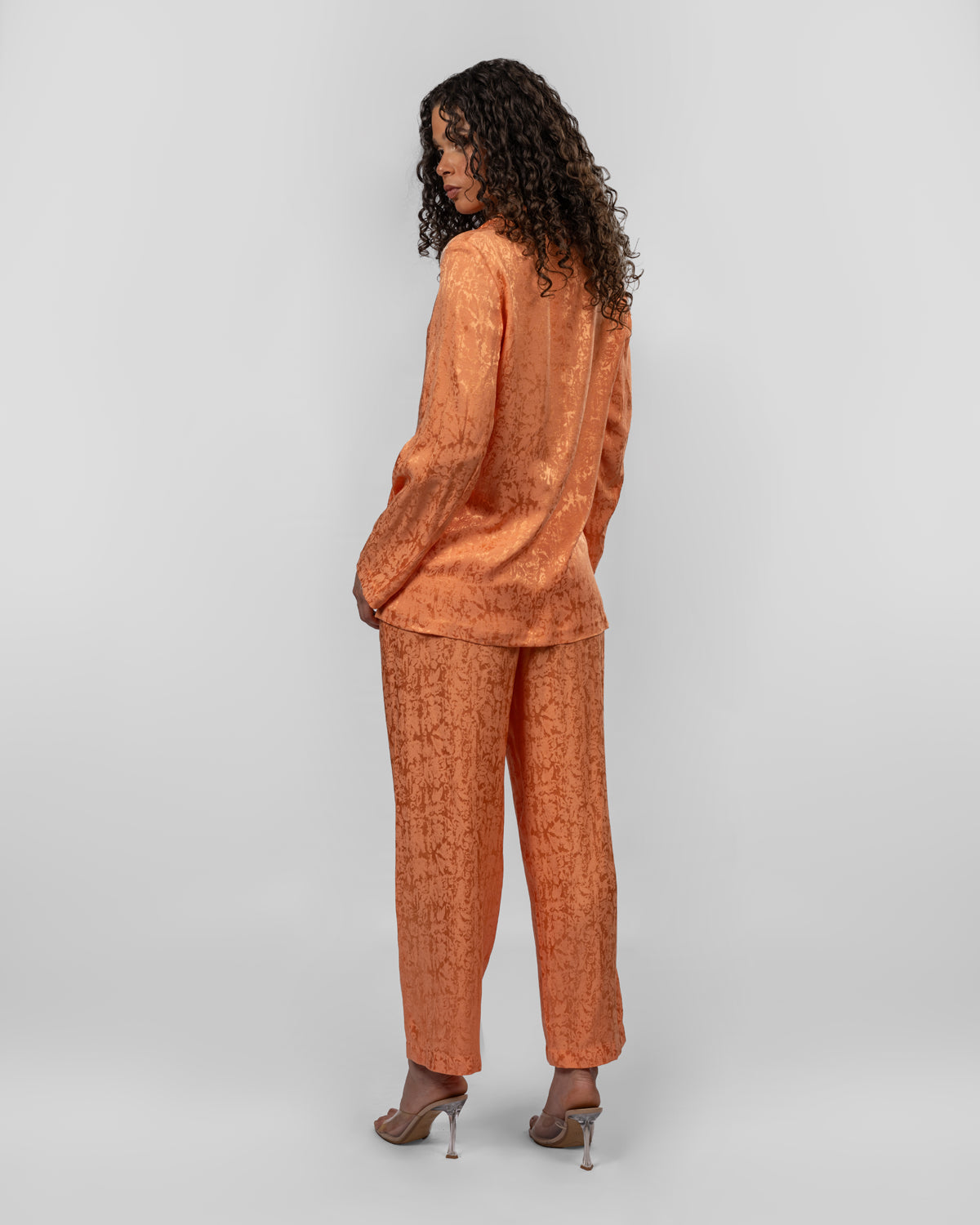 Set of loose-fit wrapped blazer and trousers.